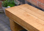 double width turns an outdoor garden bench into a table